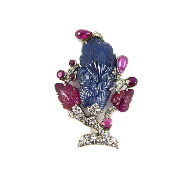Carved sapphire, ruby and diamond brooch of foliate design